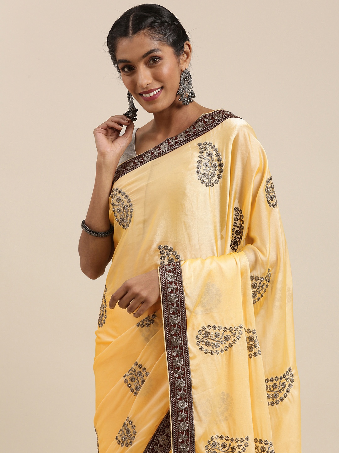 

Shaily Yellow & Brown Embellished Pure Georgette Saree
