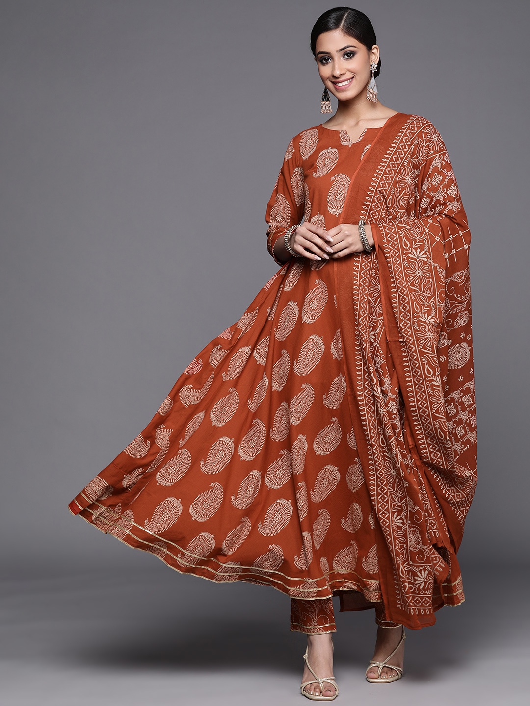 

Indo Era Women Rust Orange Paisley Printed Kurta with Trousers & Dupatta