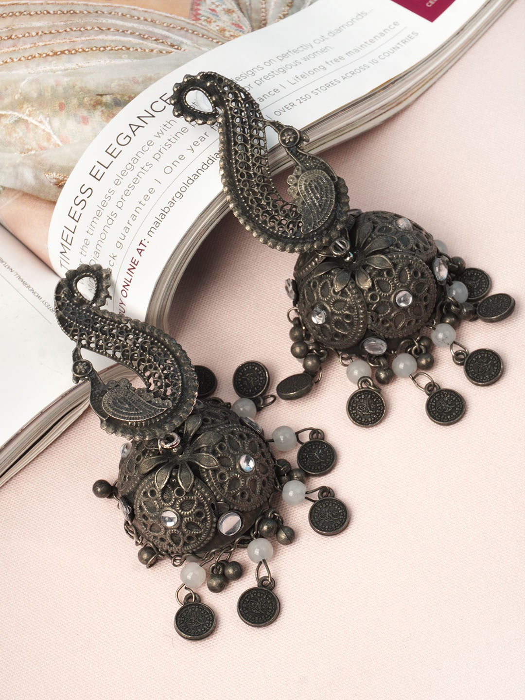 

Urmika Silver-Toned Classic Jhumkas Earrings