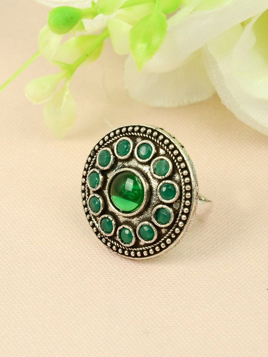 

Urmika Women Silver-Toned & Green Crystal-Studded Circular Oxidized Finger Ring