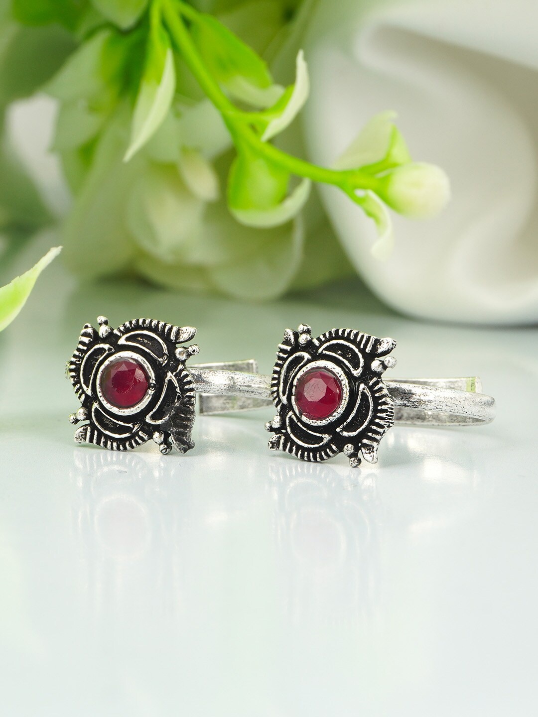 

Urmika Women Red Crystal studded Oxidized Silver Toe Rings