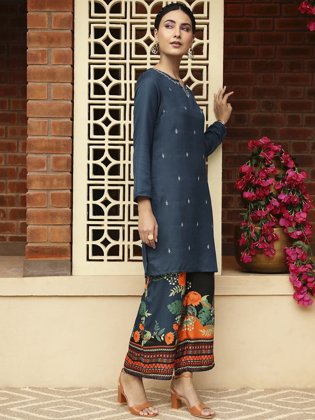 

Sangria Women Teal Blue & Red Ethnic Motifs Embroidered Kurta with Trousers