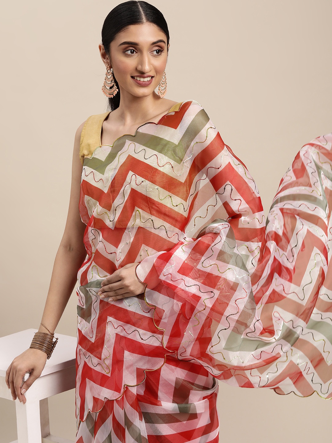 

VASTRANAND White & Orange Chevron Aari Work Organza Saree