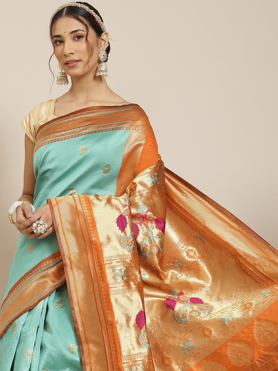 

Warthy Ent Green & Orange Ethnic Motifs Zari Silk Blend Kanjeevaram Saree