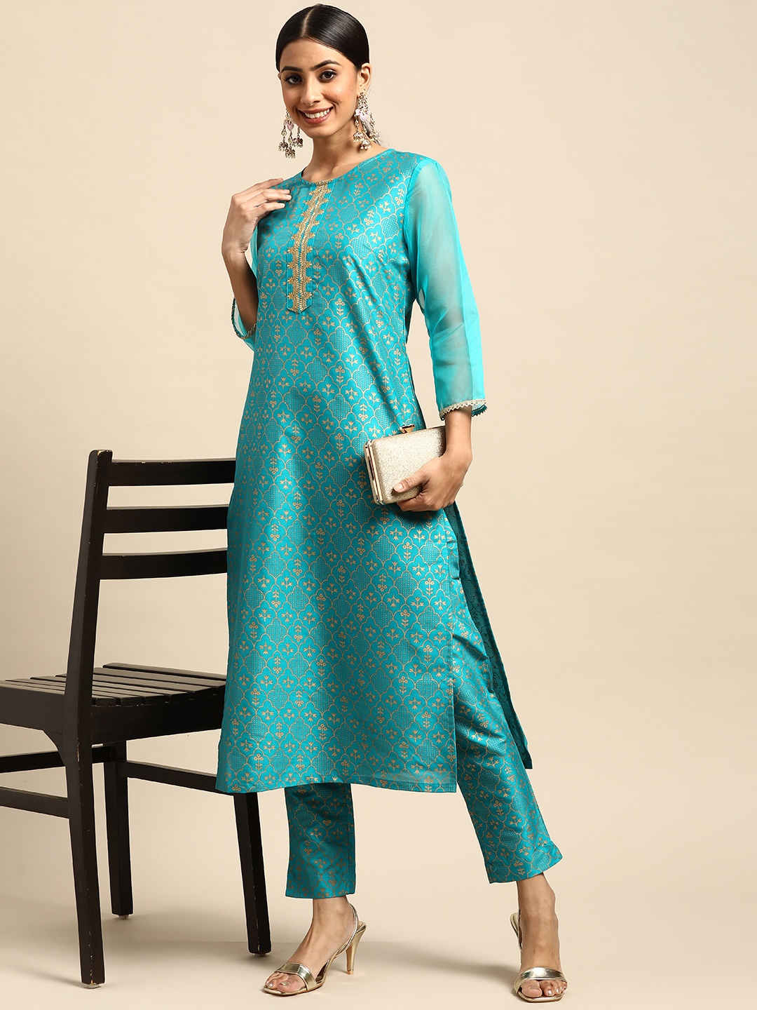 

Sangria Women Teal Blue & Golden Ethnic Motifs Printed Kurta with Trousers