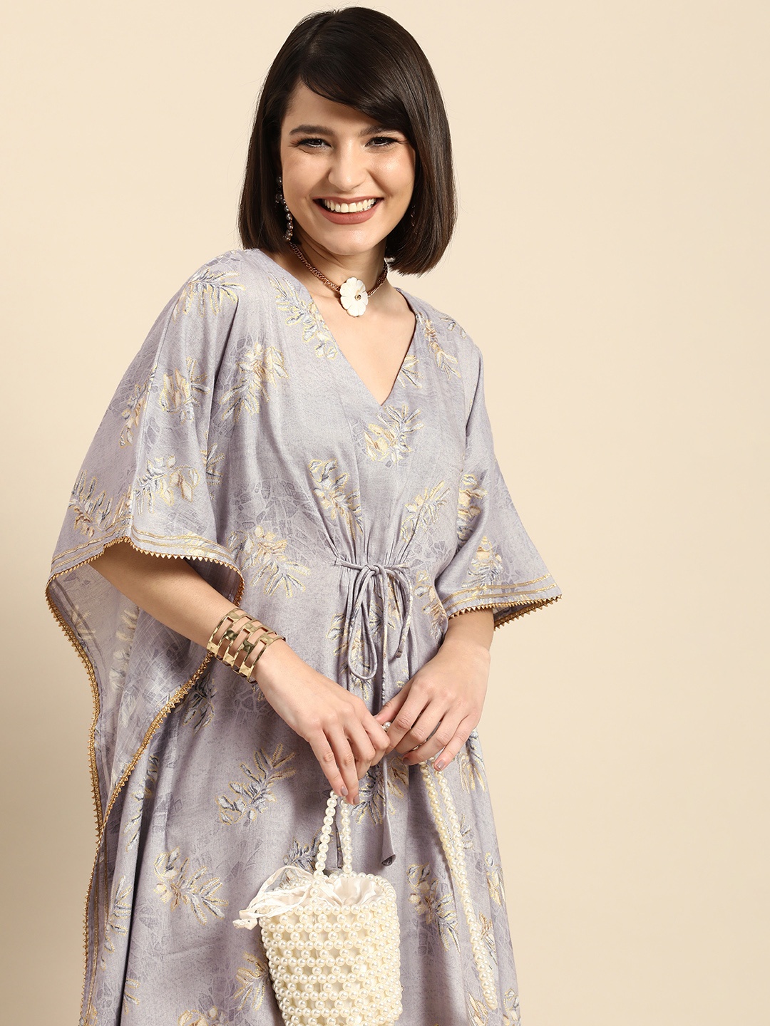

Anouk Women Purple & Gold-Toned Floral Printed Extended Sleeves Gotta Patti Kaftan Kurta