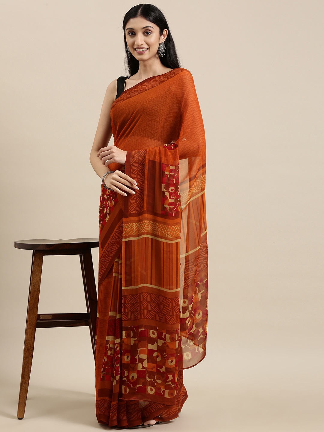 

Shaily Rust Orange Abstract Print Saree With Unstitched Blouse