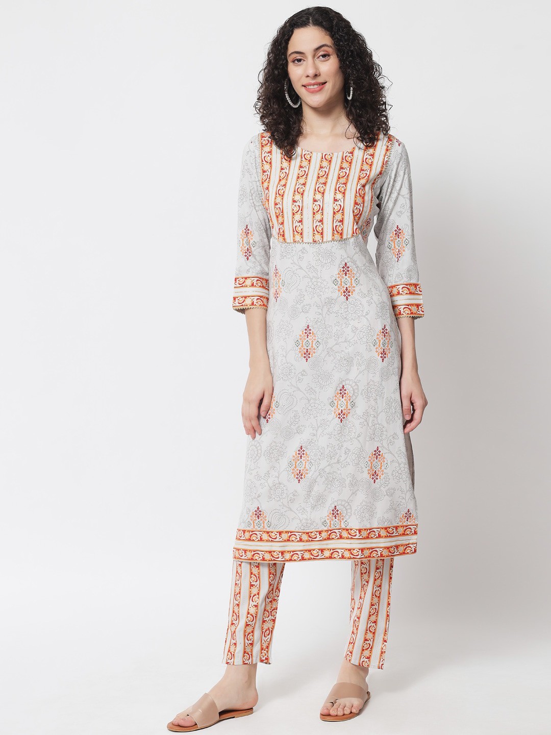 

Meeranshi Women Beige Ethnic Motifs Embroidered Empire Gotta Patti Kurti with Trousers