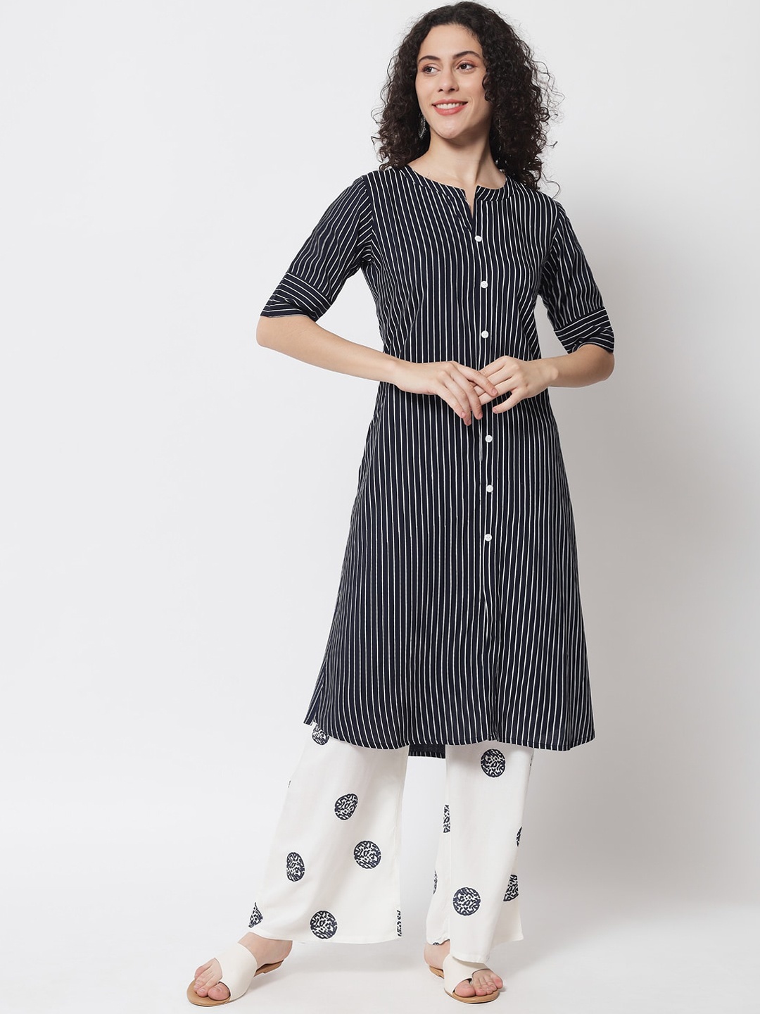 

Meeranshi Women Navy Blue Striped Pleated Beads and Stones Kurti with Trousers