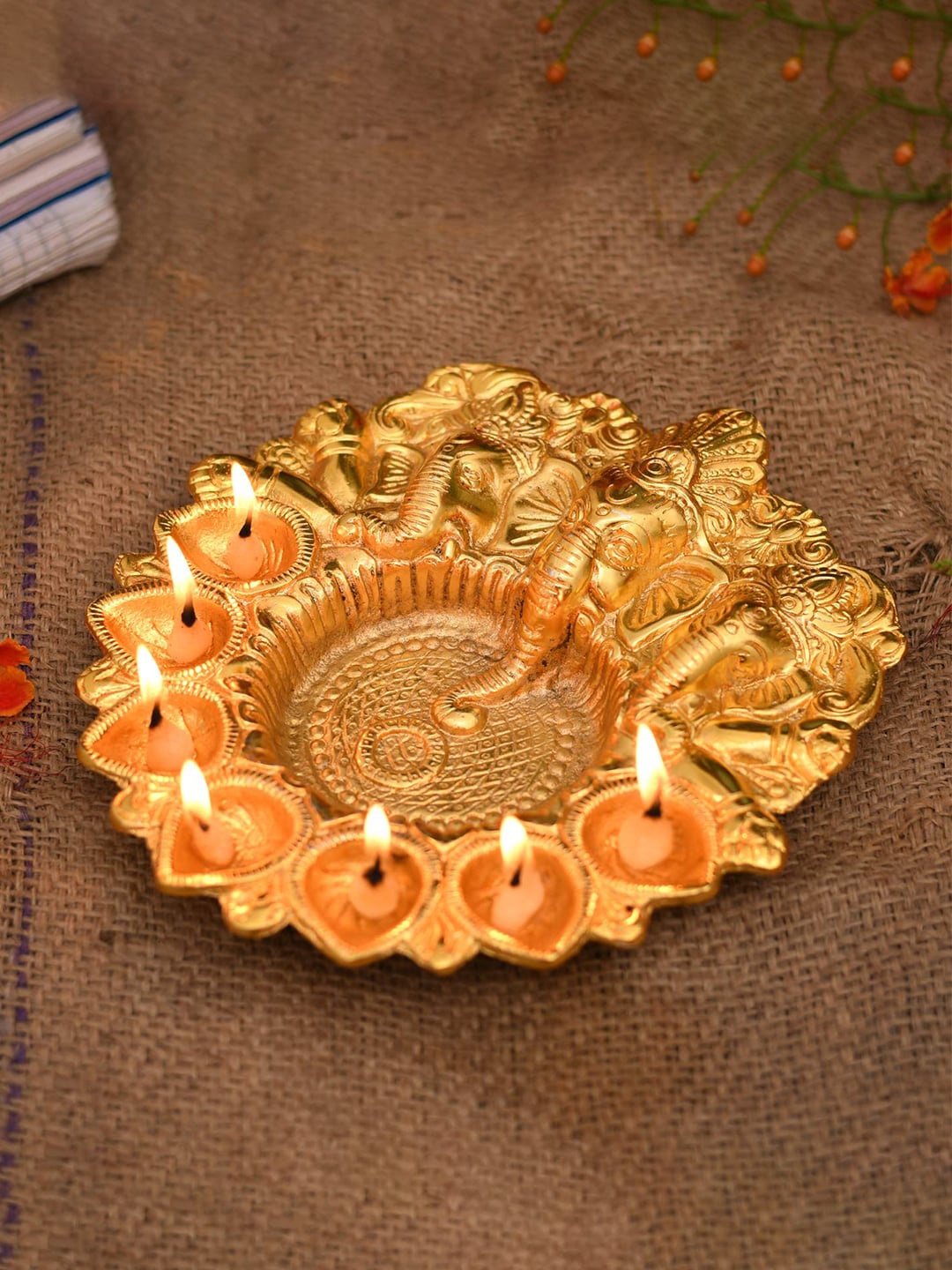 

Craftvatika Gold-Toned Metal Lord Ganesha Design Kuber Diya