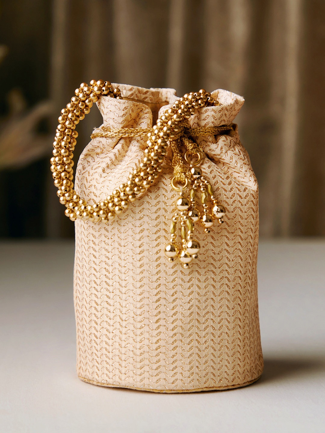 

Rubans Cream-Coloured & Gold-Toned Textured Potli Clutch