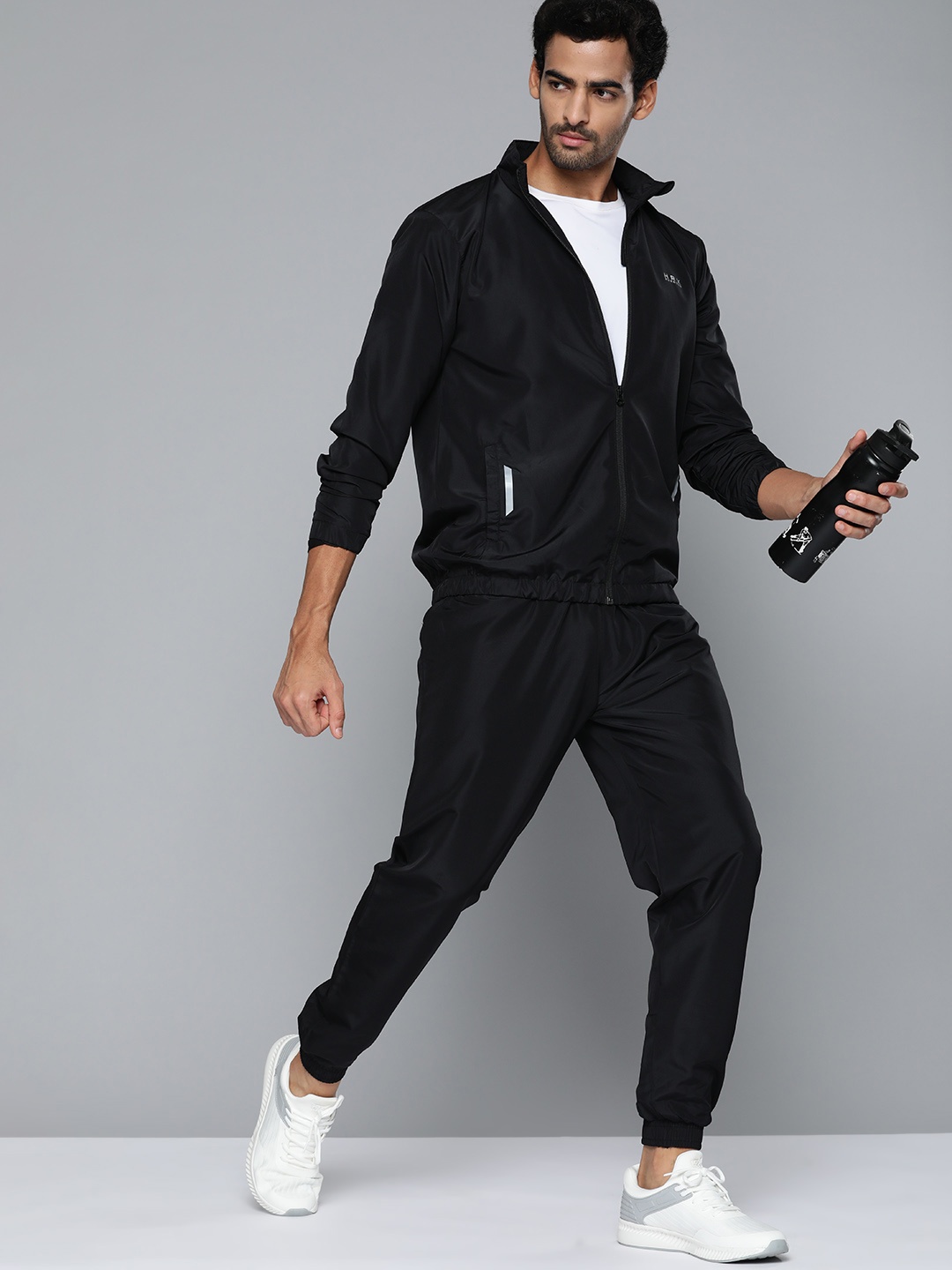 

HRX by Hrithik Roshan Men Black Solid Running Tracksuits