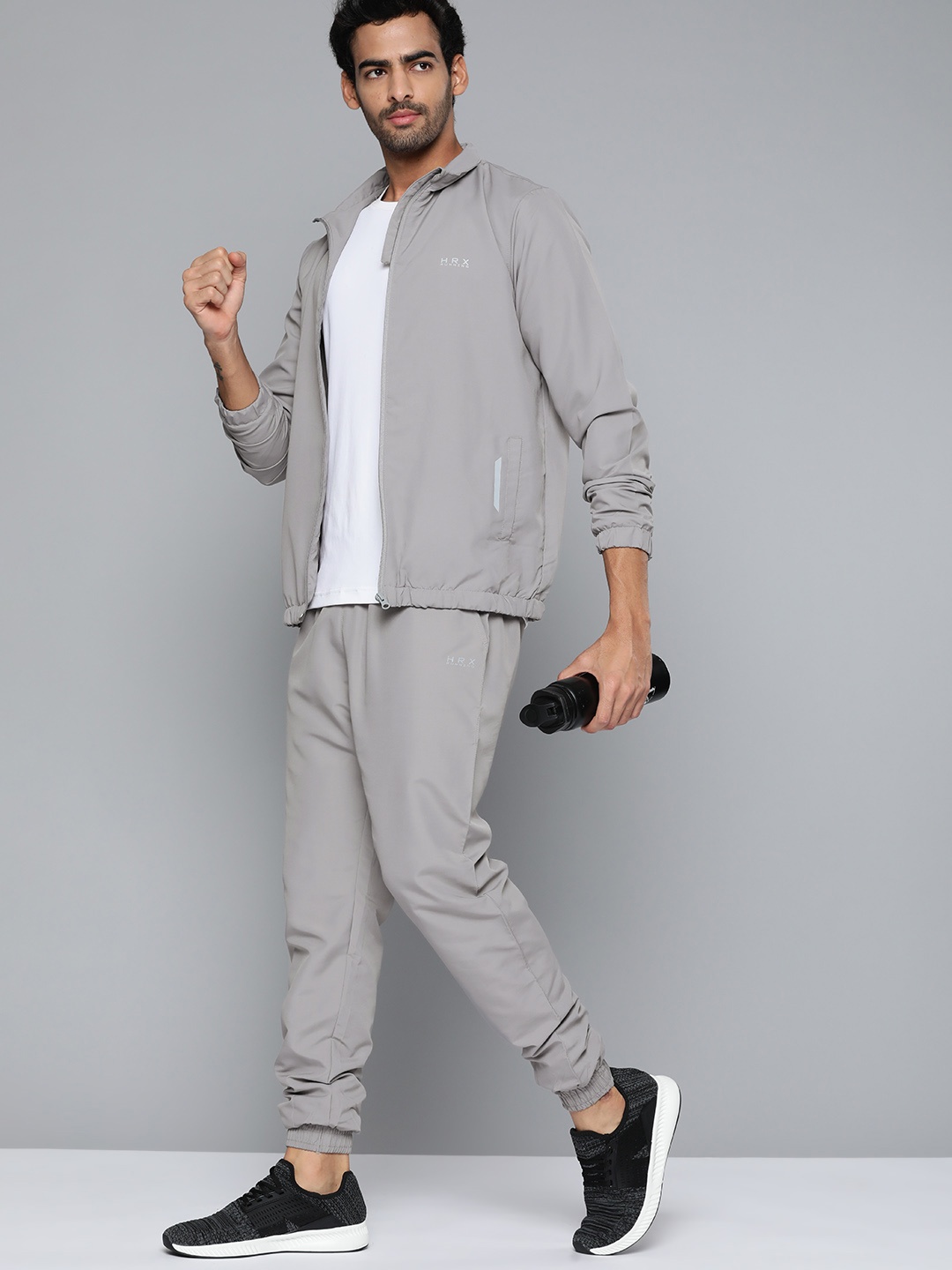 

HRX by Hrithik Roshan Men Grey Solid Running Tracksuits