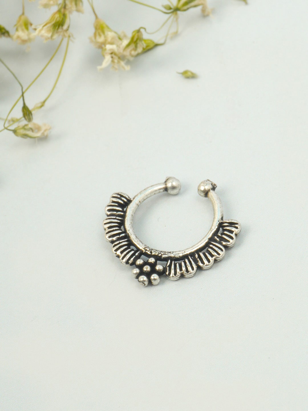

Urmika Oxidised Silver-Toned Petal-Design Handcrafted Nosepin