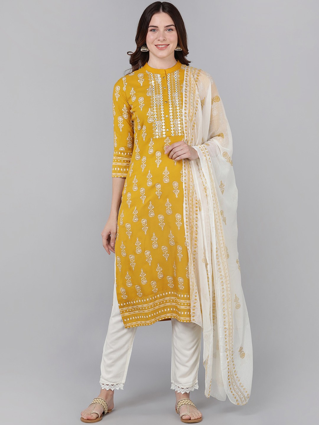 

Bani Women Mustard Yellow Ethnic Motifs Printed Mirror Work Liva Kurta with Trousers & With Dupatta