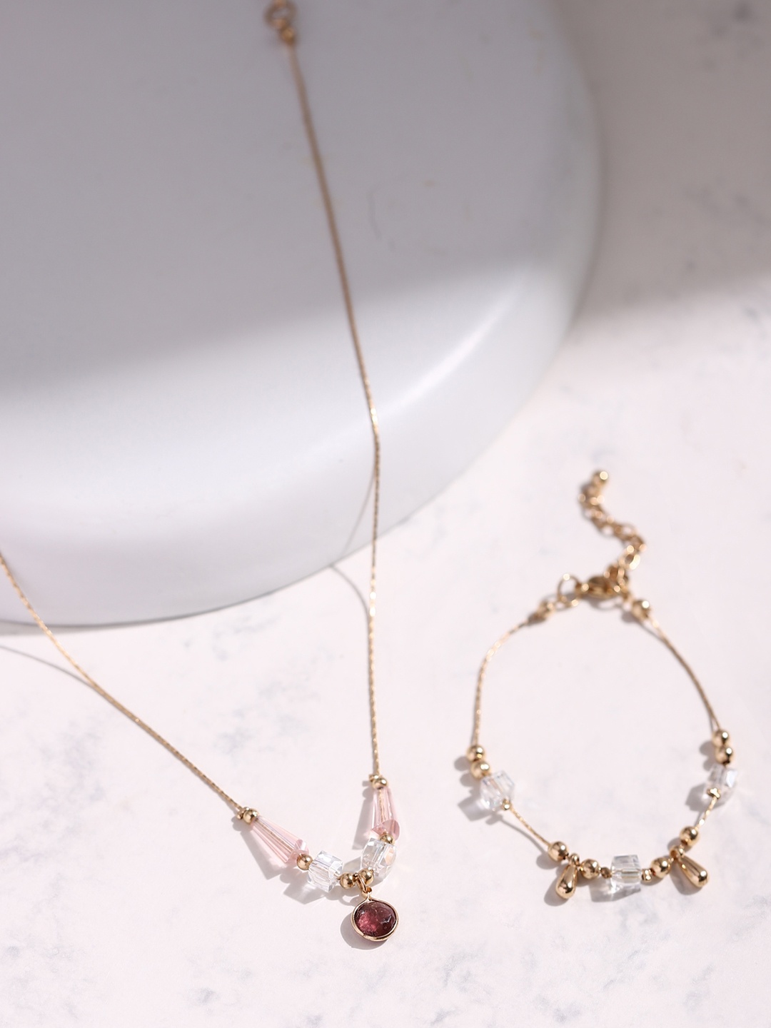 

DEEBACO Women Rose Gold-Plated Red & White Stone Studded Jewellery Set