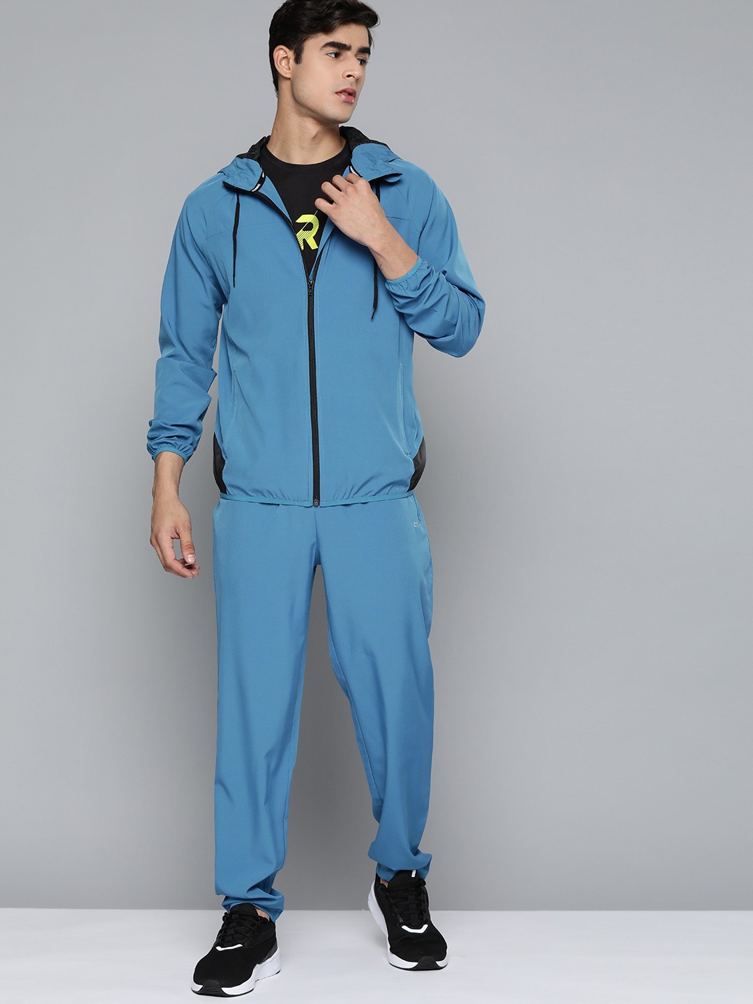 

HRX by Hrithik Roshan Men Blue Solid Running Tracksuits