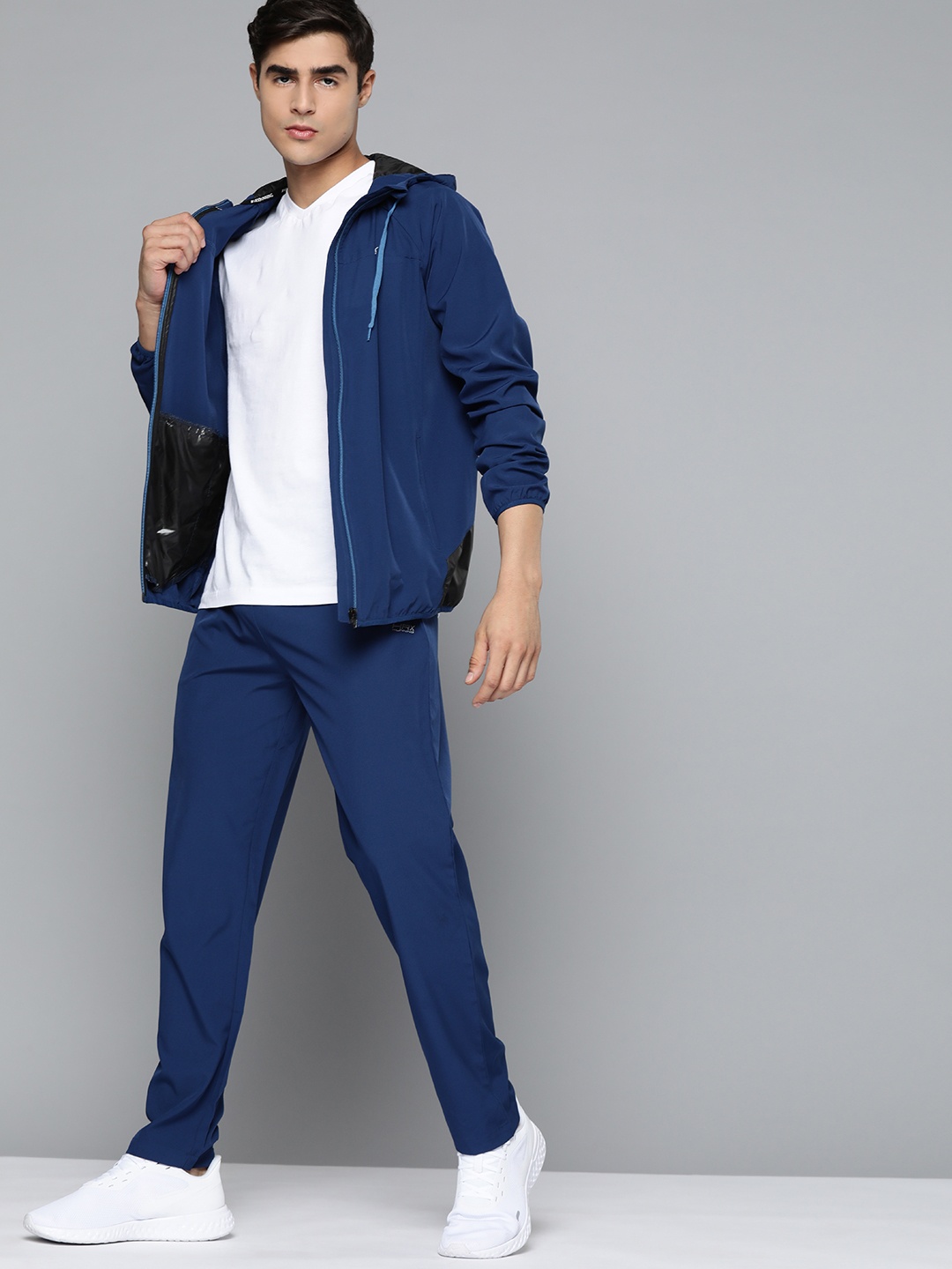

HRX by Hrithik Roshan Men Navy Blue Solid Running Tracksuits