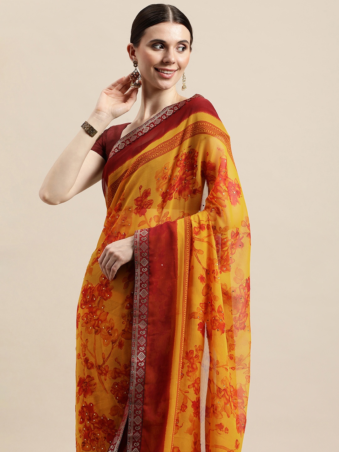 

Triveni Yellow & Red Floral Beads and Stones Pure Chiffon Celebrity Saree