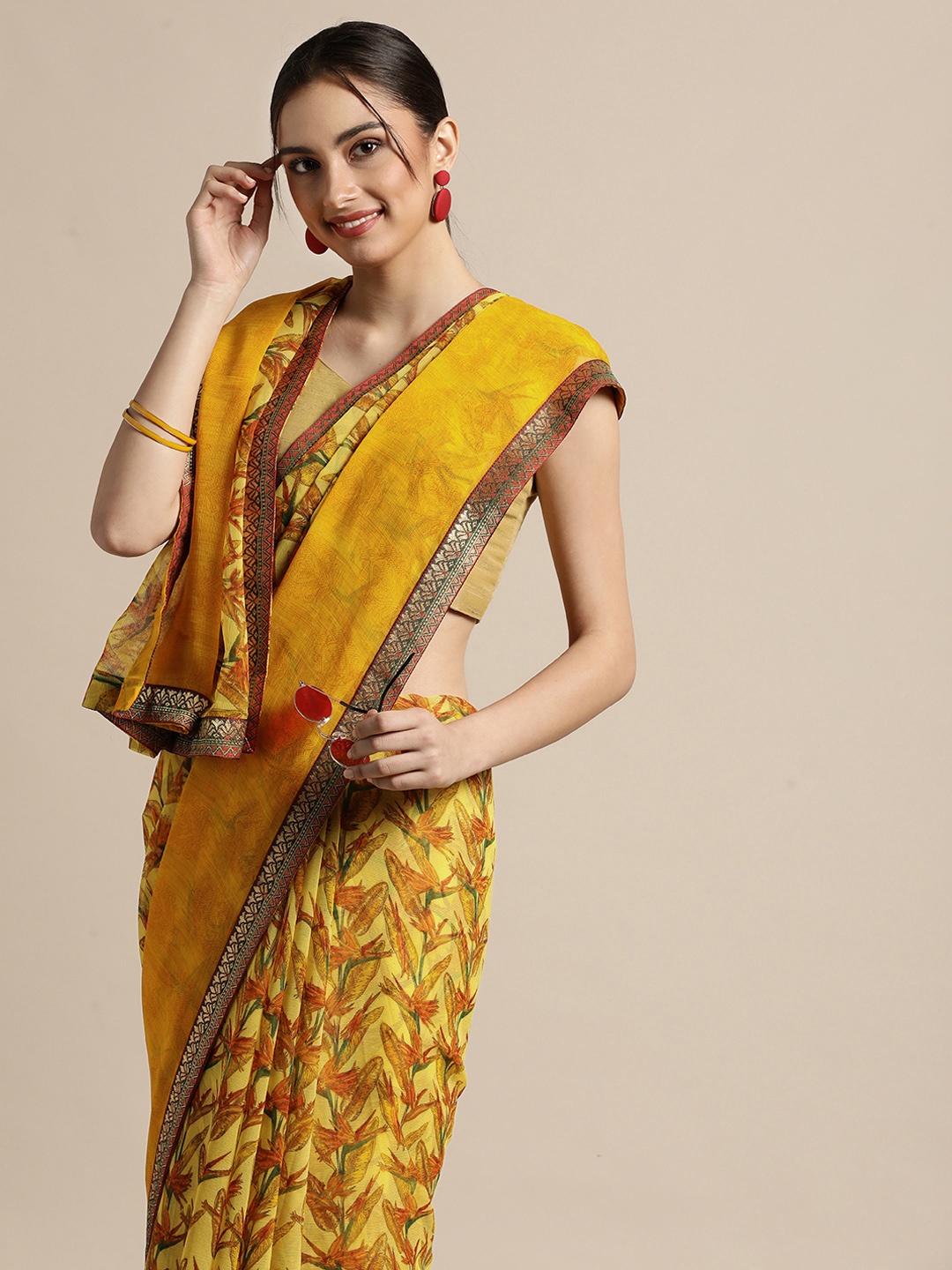 

Triveni Yellow & Orange Floral Pure Chiffon Celebrity Saree