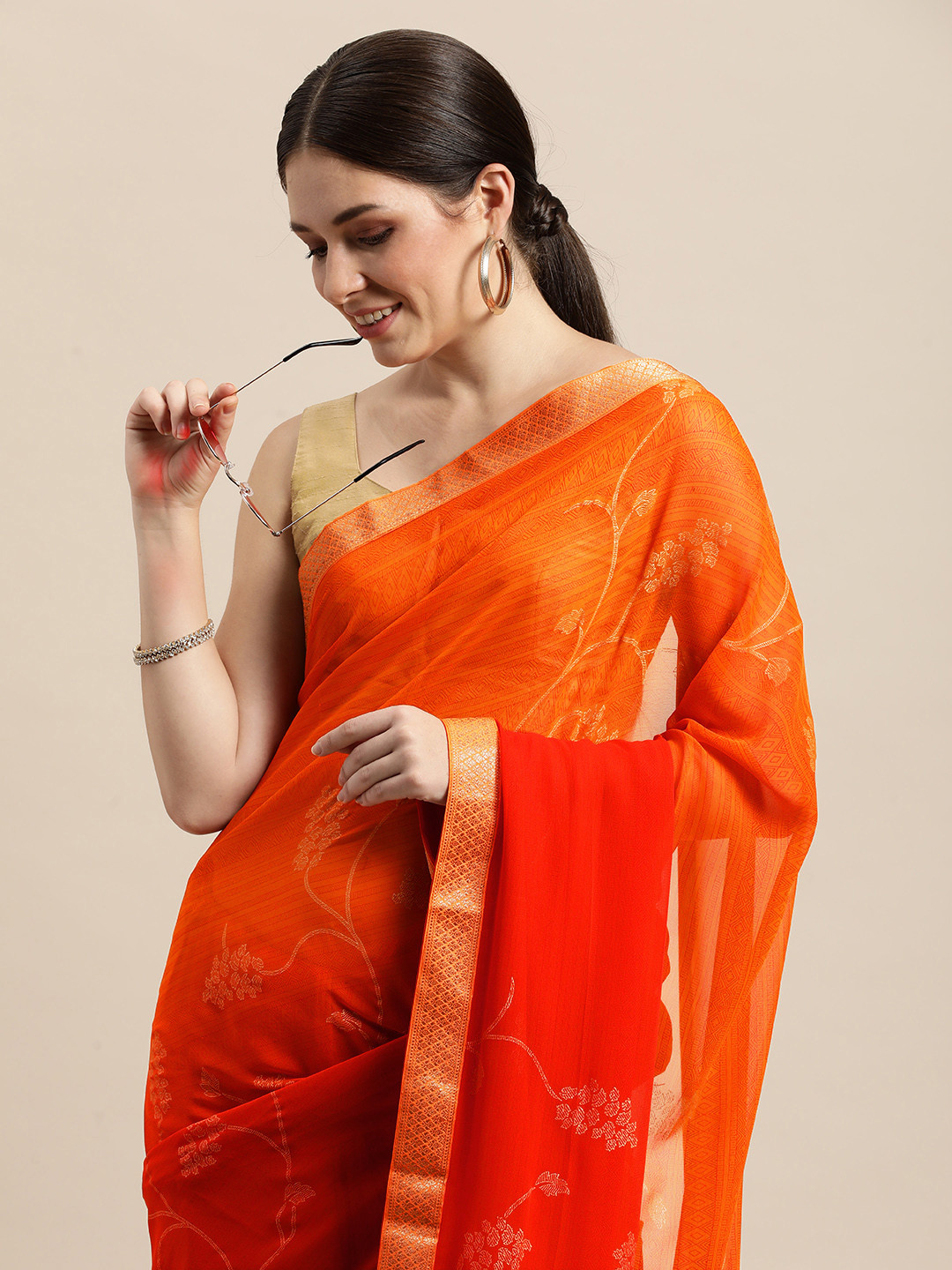

Triveni Orange Floral Printed Zari Pure Georgette Saree