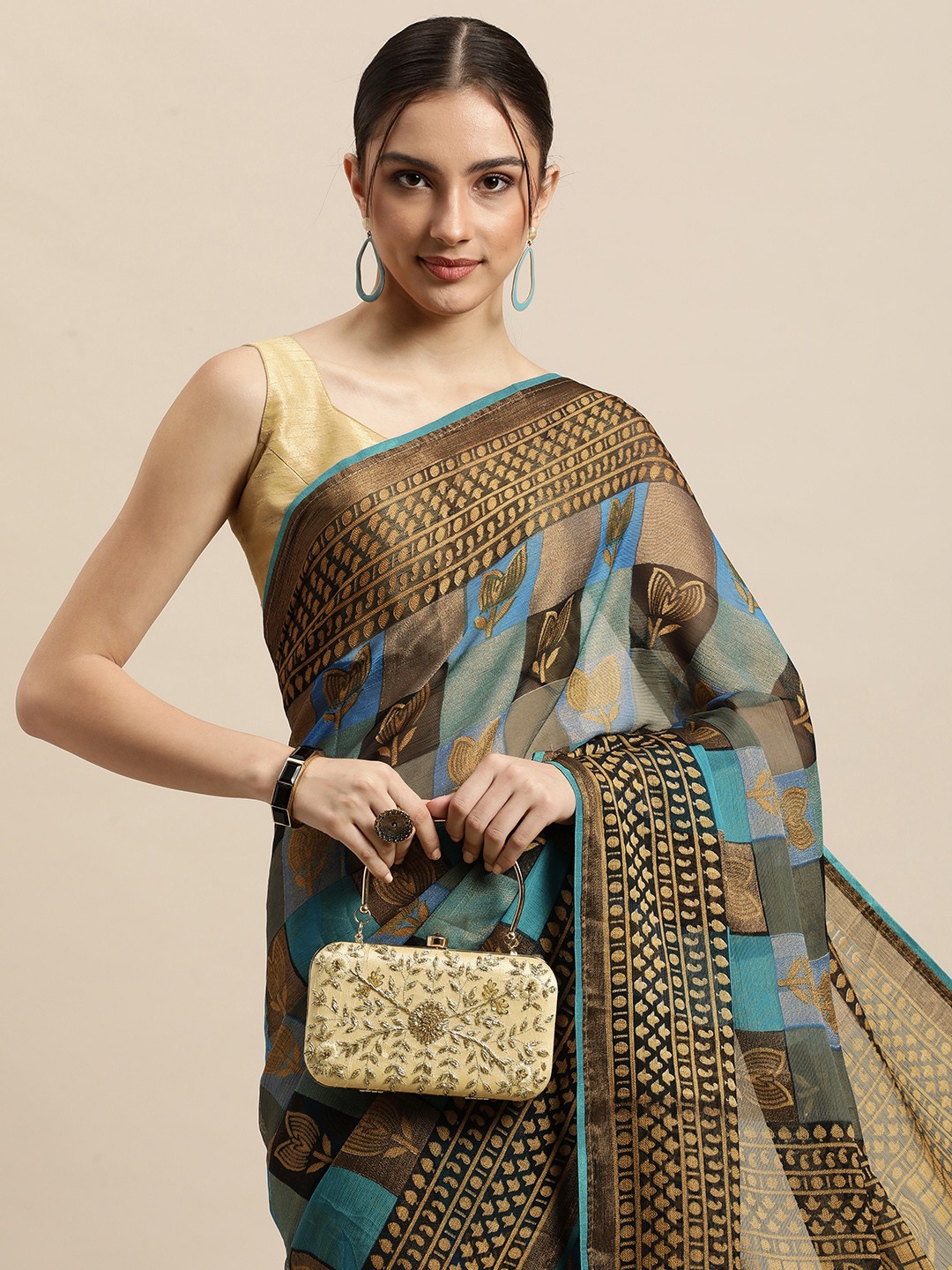 

Triveni Blue & Gold Floral Brasso Celebrity Saree
