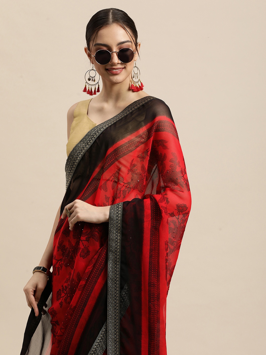 

Triveni Red & Black Ethnic Motifs Beads and Stones Pure Chiffon Saree