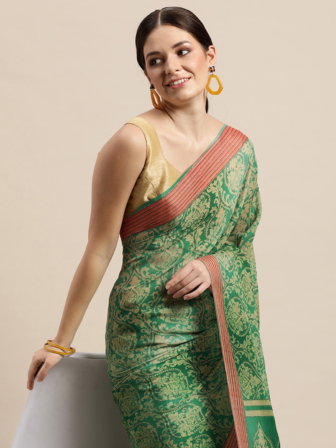 

Triveni Green & Beige Ethnic Motifs Printed Zari Pure Georgette Saree
