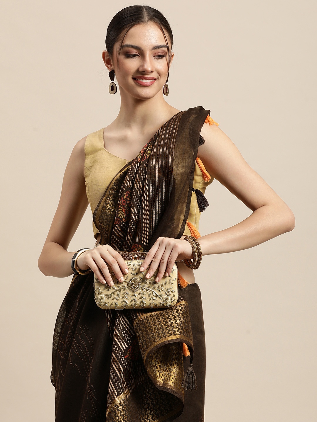 

Triveni Brown & Golden Ethnic Motifs Printed Pure Cotton Saree