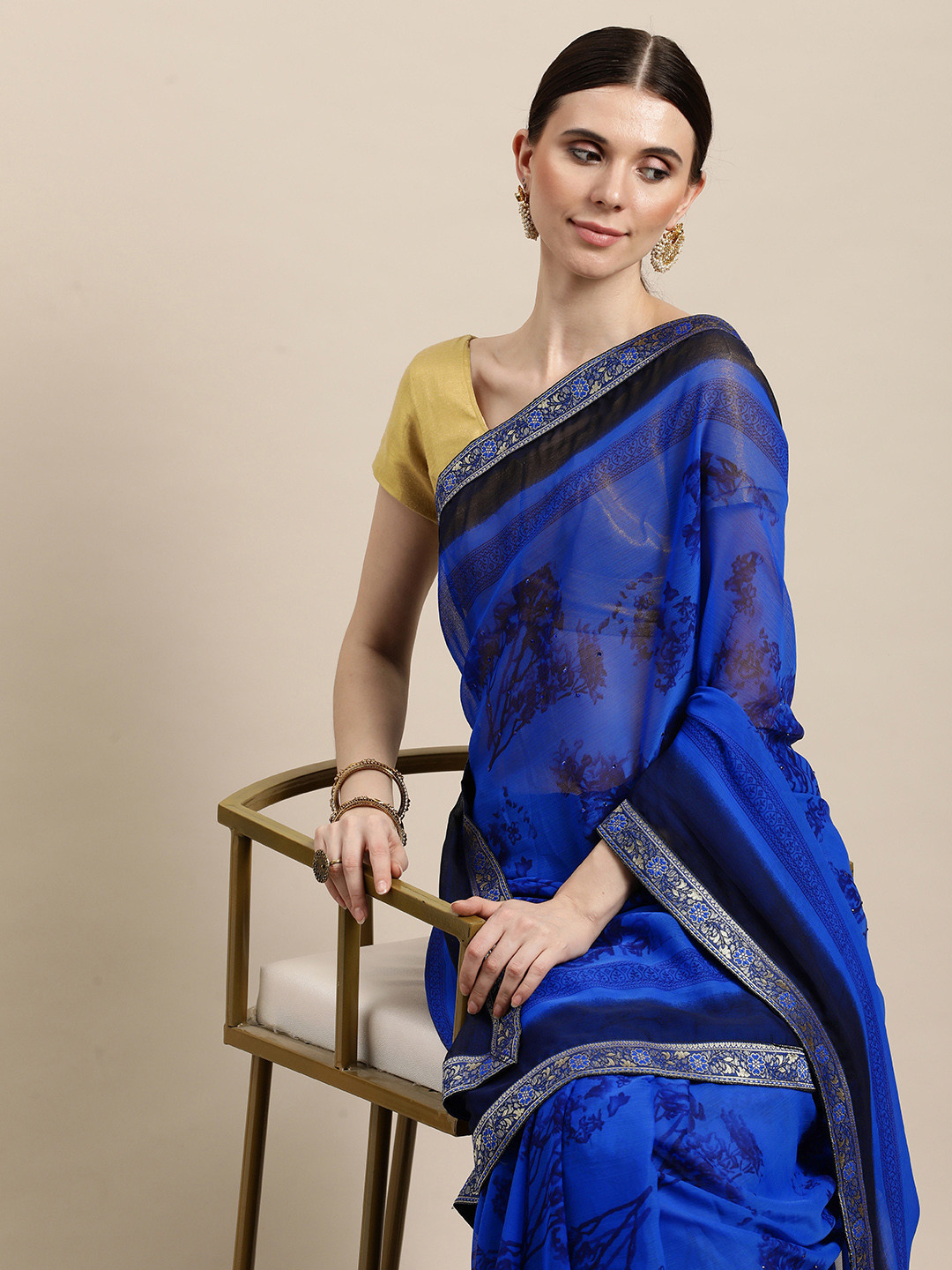 

Triveni Navy Blue Floral Beads and Stones Pure Chiffon Saree