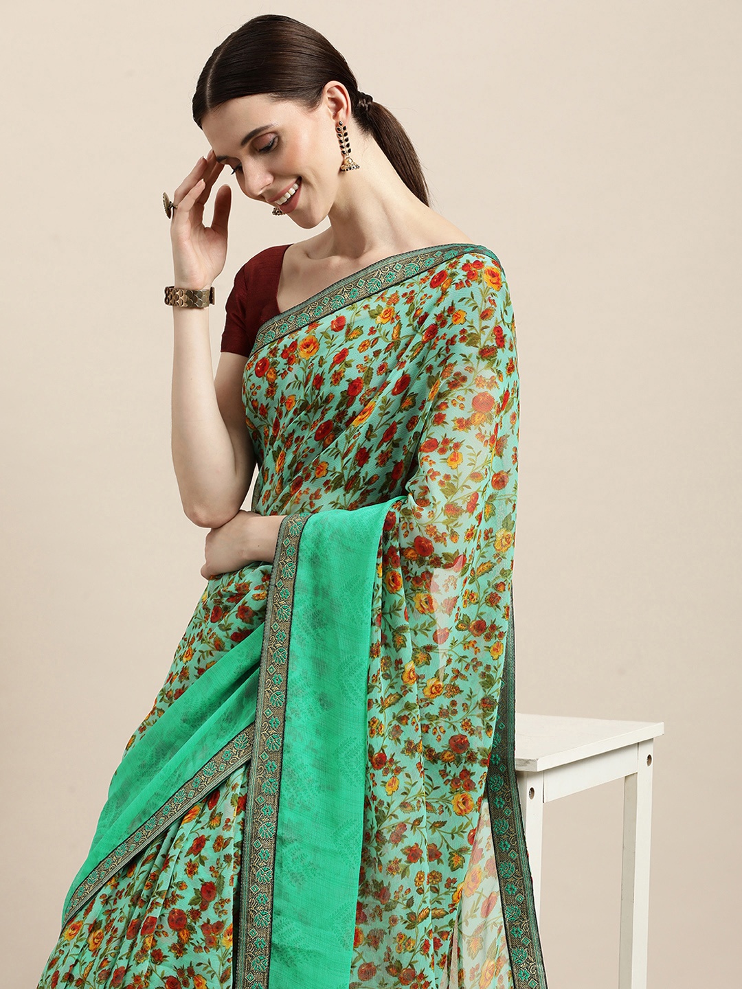 

Triveni Green & Red Floral Pure Chiffon Celebrity Saree