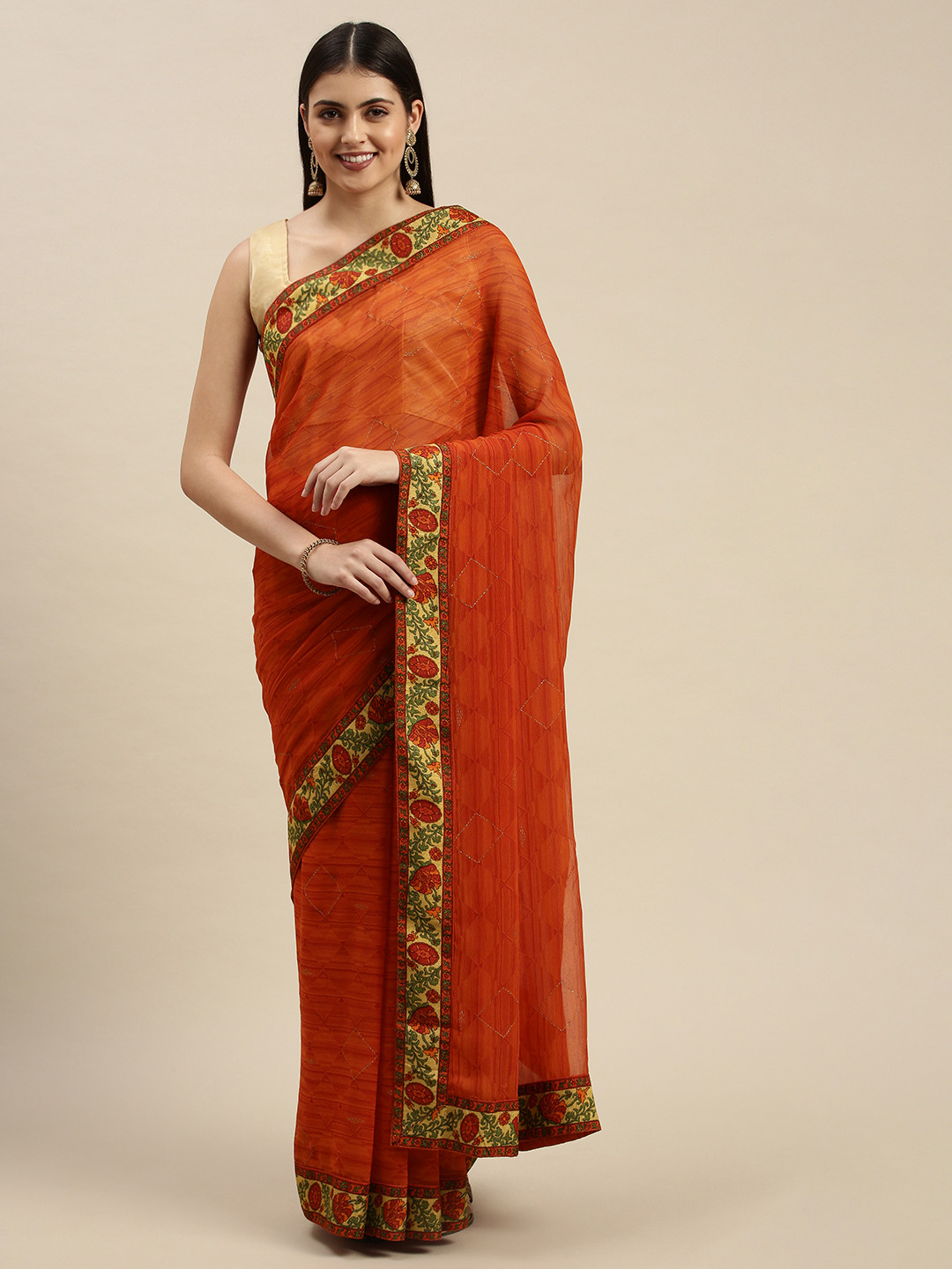 

Triveni Orange Floral Zari Pure Georgette Saree