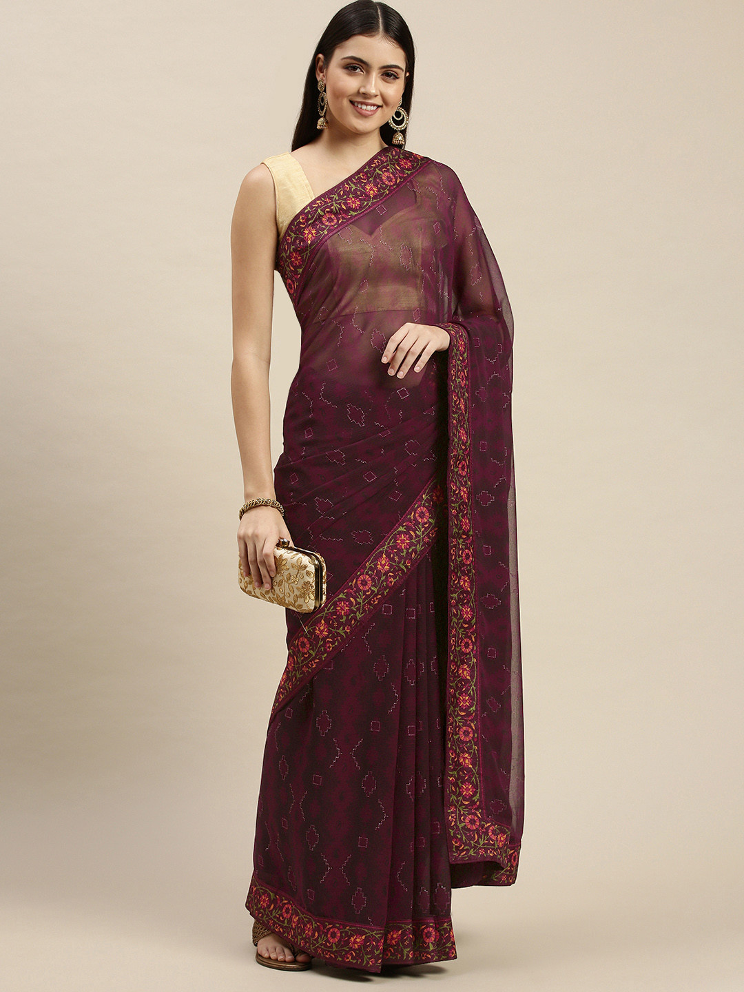 

Triveni Violet & Orange Ethnic Motifs Beads and Stones Pure Georgette Saree