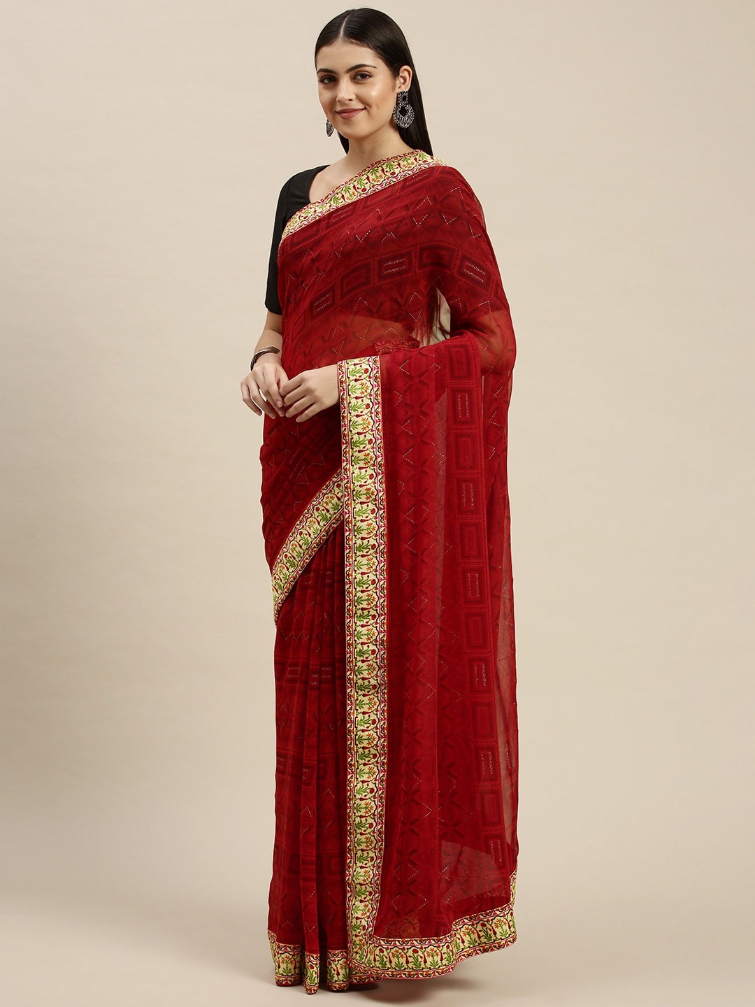 

Triveni Maroon Printed Zari Pure Georgette Saree