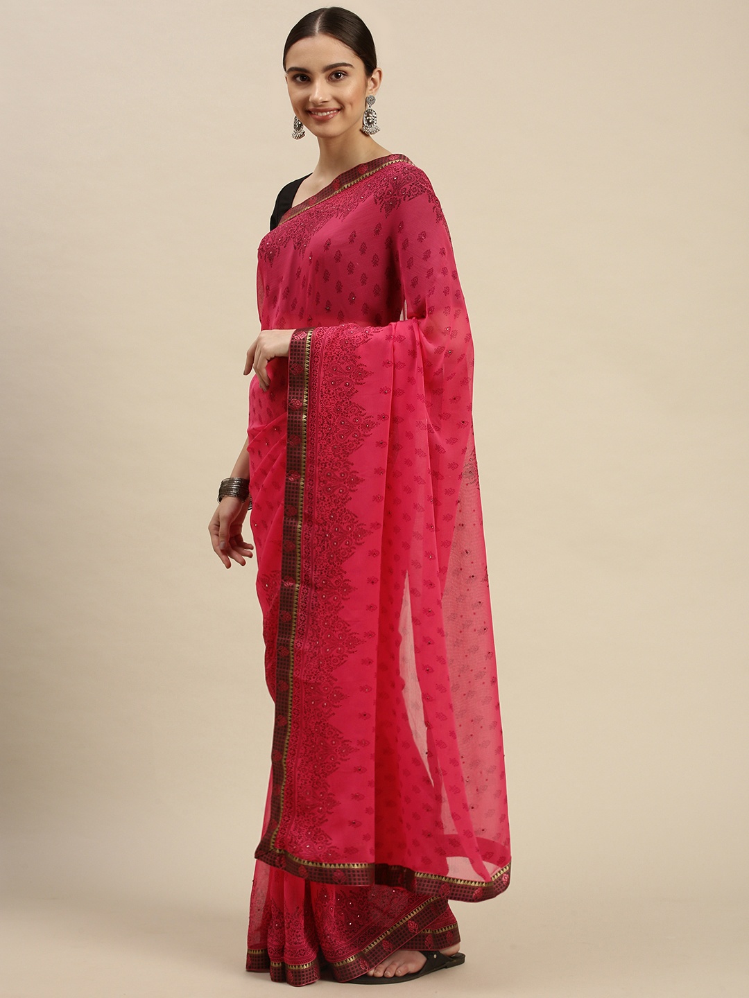 

Triveni Pink Ethnic Motifs Print Beads and Stones Embellished Pure Chiffon Saree