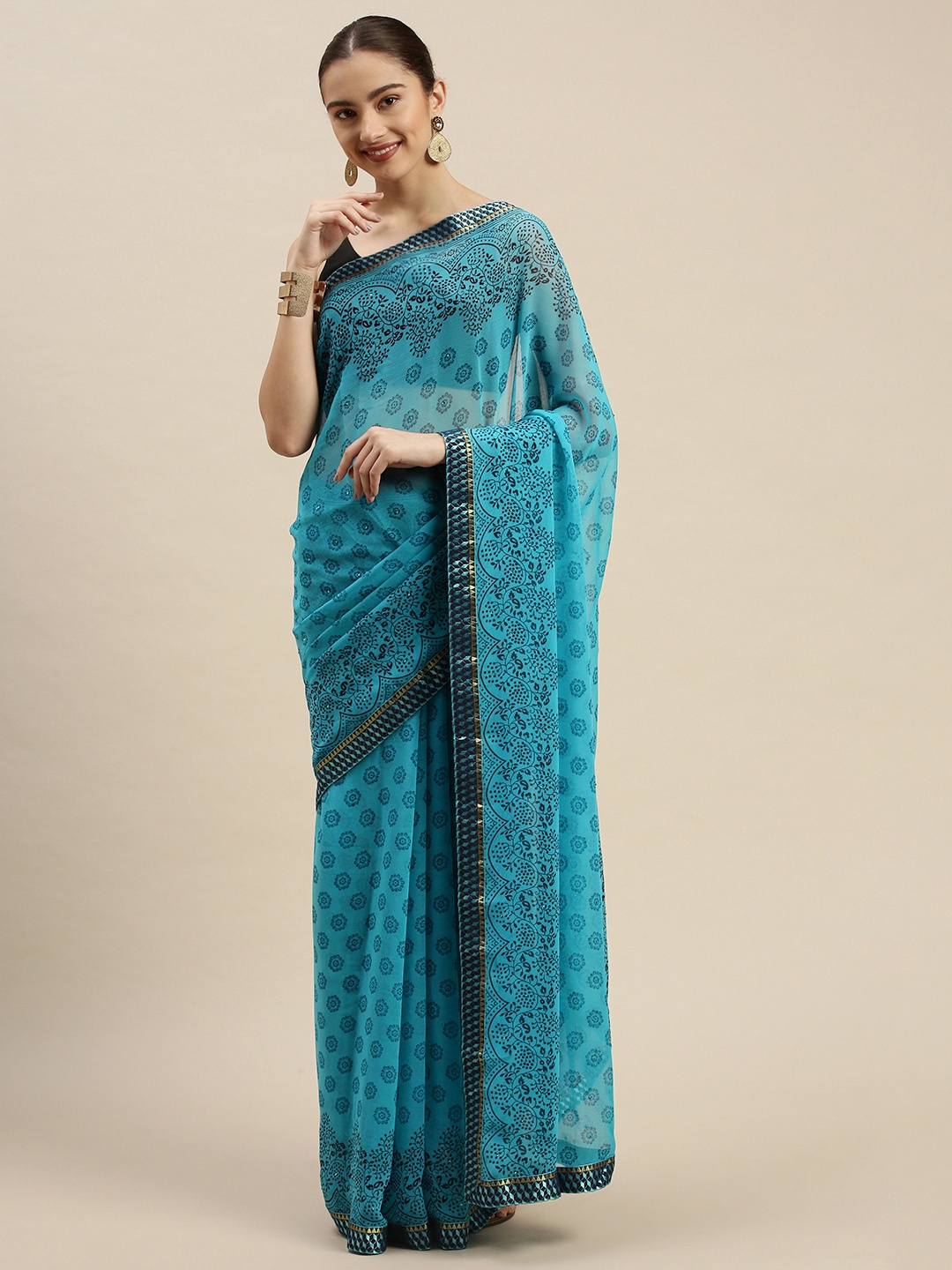 

Triveni Blue & Black Paisley Beads and Stones Embellished Pure Chiffon Saree