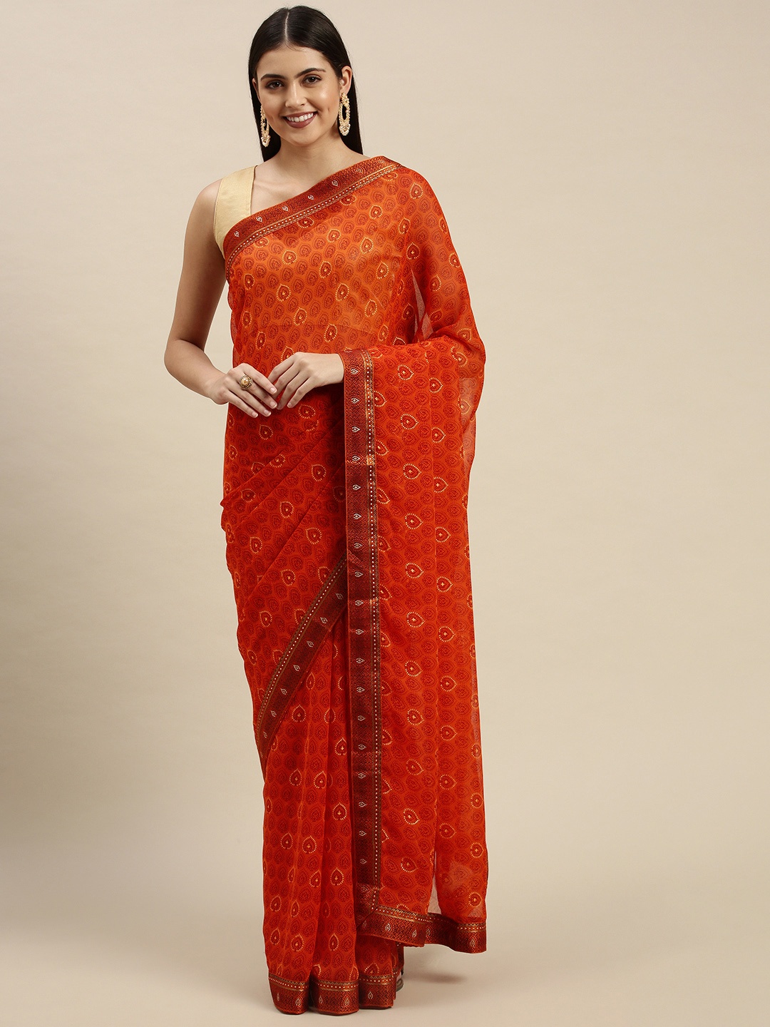 

Triveni Orange & Yellow Ethnic Motifs Print Beads and Stones Embellished Chiffon Saree
