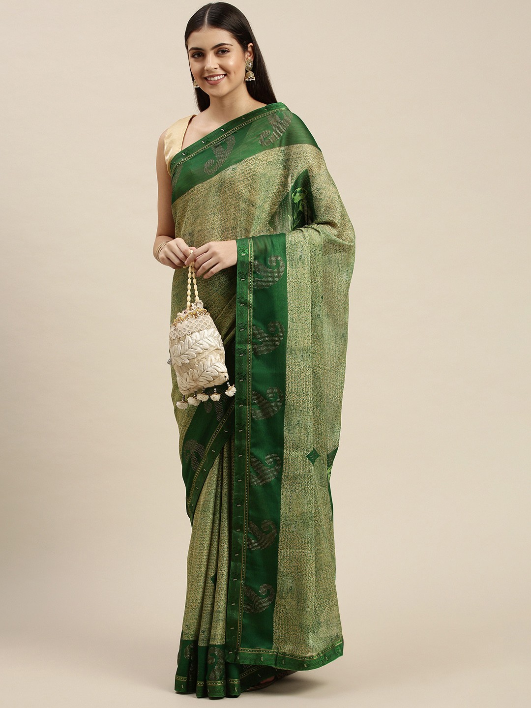 

Triveni Green Ethnic Motifs Zari Saree