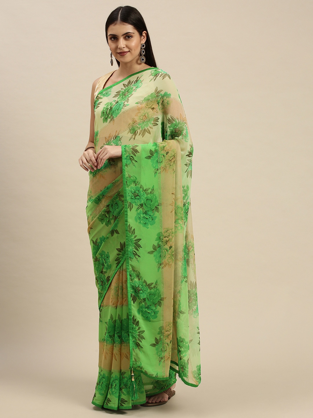 

Triveni Green Floral Zari Pure Georgette Saree