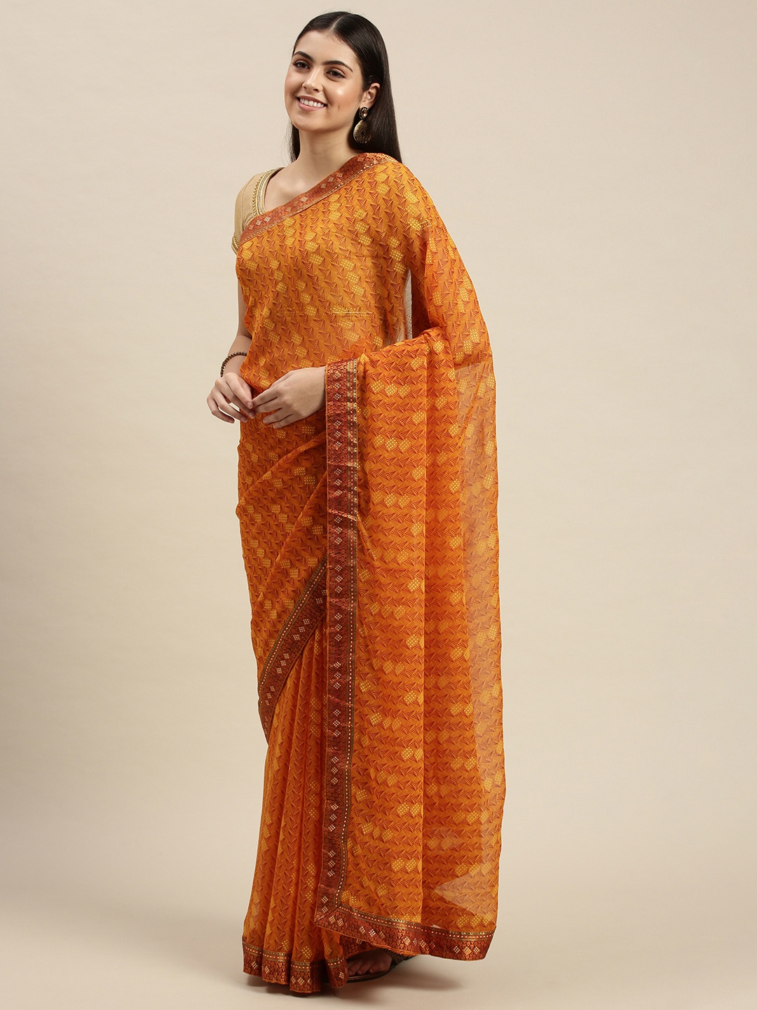 

Triveni Mustard Yellow Ethnic Motifs Beads and Stones Pure Chiffon Saree