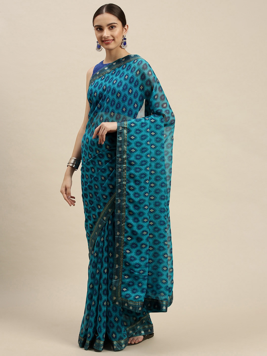 

Triveni Blue & White Ethnic Motifs Beads and Stones Pure Chiffon Saree