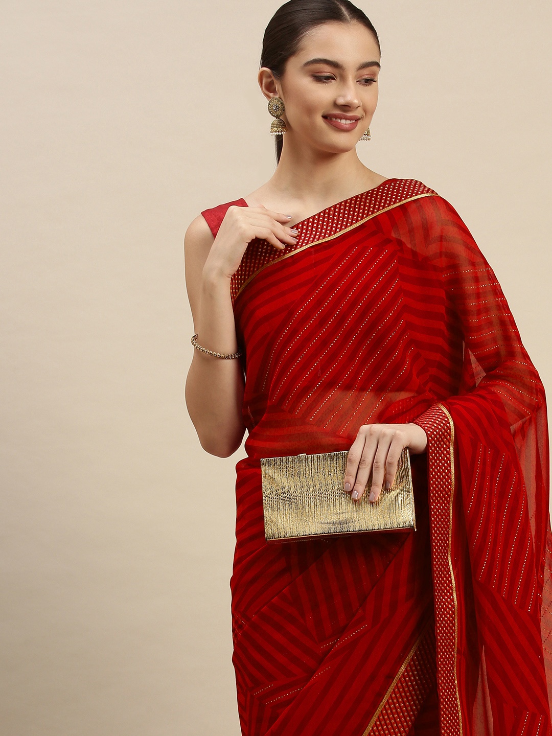 

Triveni Red Striped Beads and Stones Embellished Pure Georgette Leheriya Saree