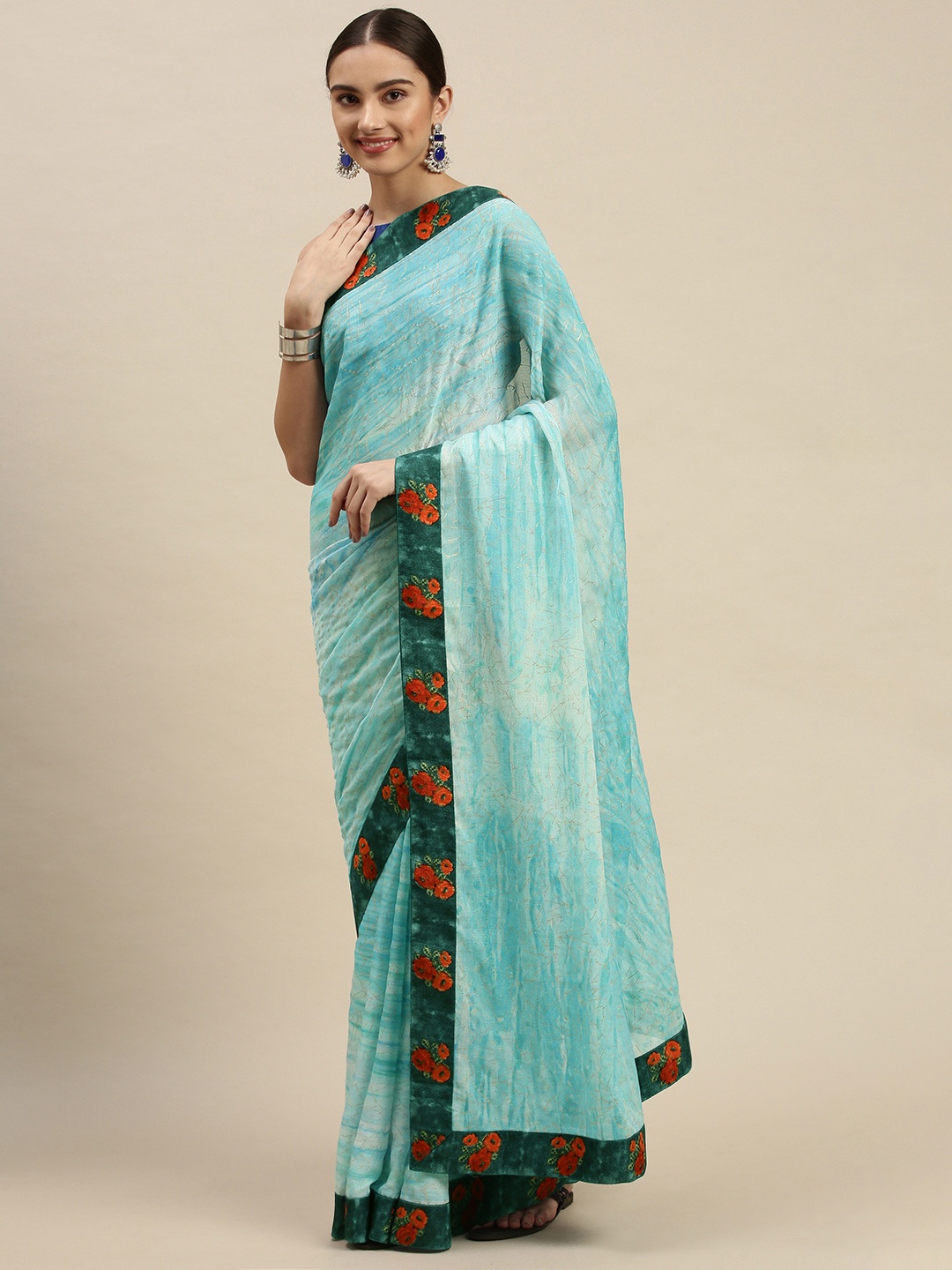 

Triveni Blue & Orange Abstract Print Saree