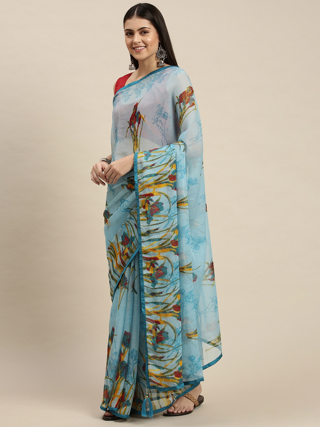 

Triveni Blue & Mustard Yellow Floral Pure Chiffon Saree