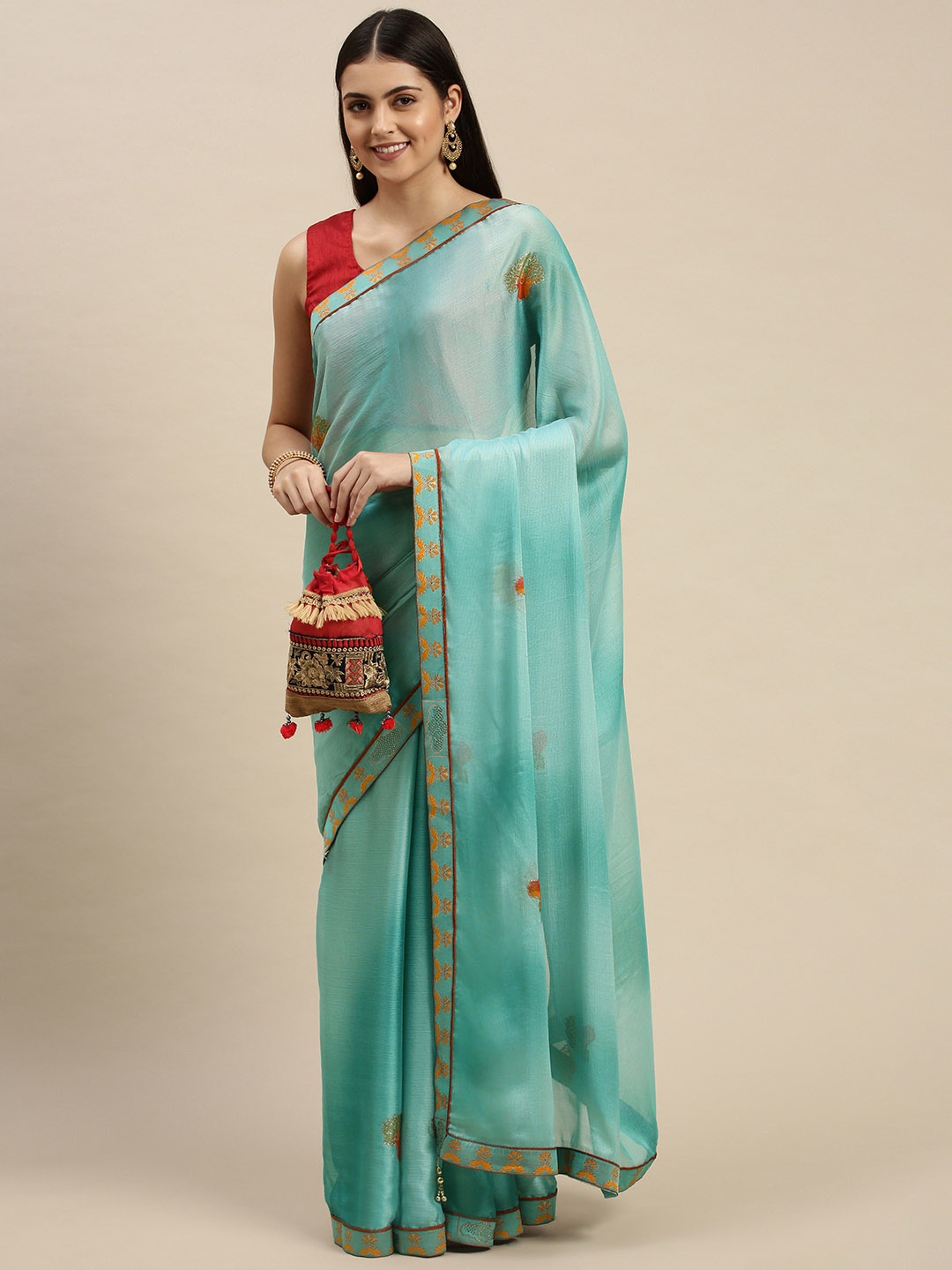 

Triveni Green Embellished Zari Saree
