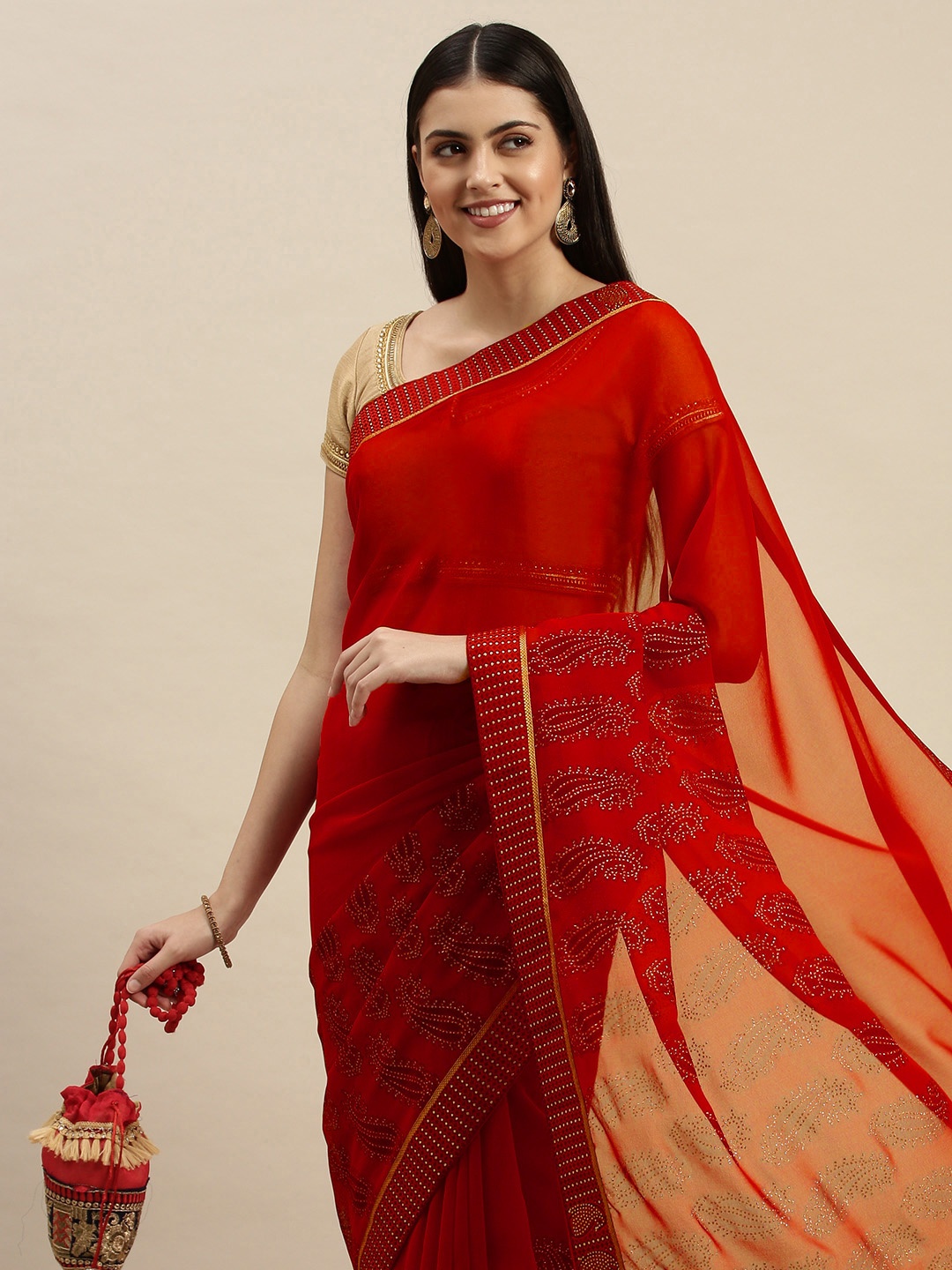 

Triveni Red Embellished Pure Georgette Saree