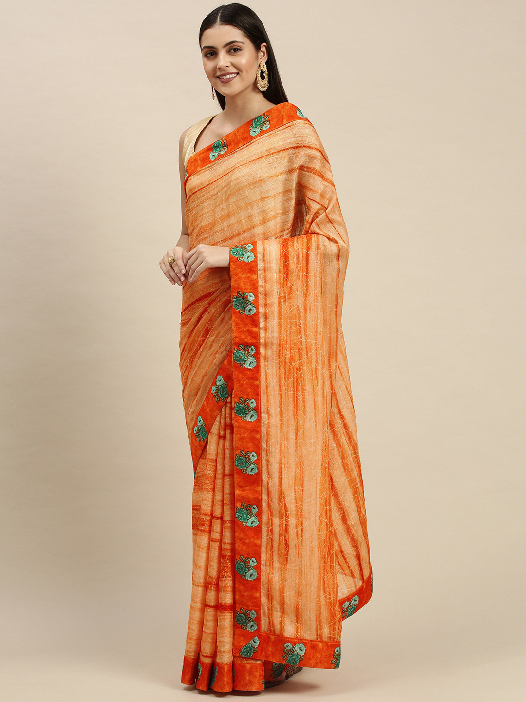 

Triveni Orange & Sea Green Abstract Print Saree