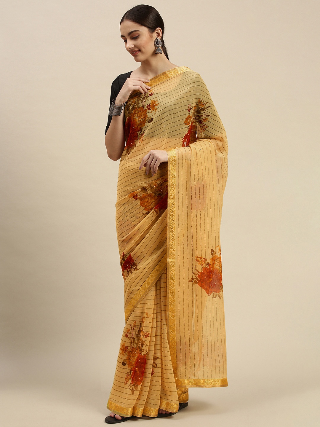 

Triveni Yellow & Maroon Floral Silk Blend Chanderi Saree