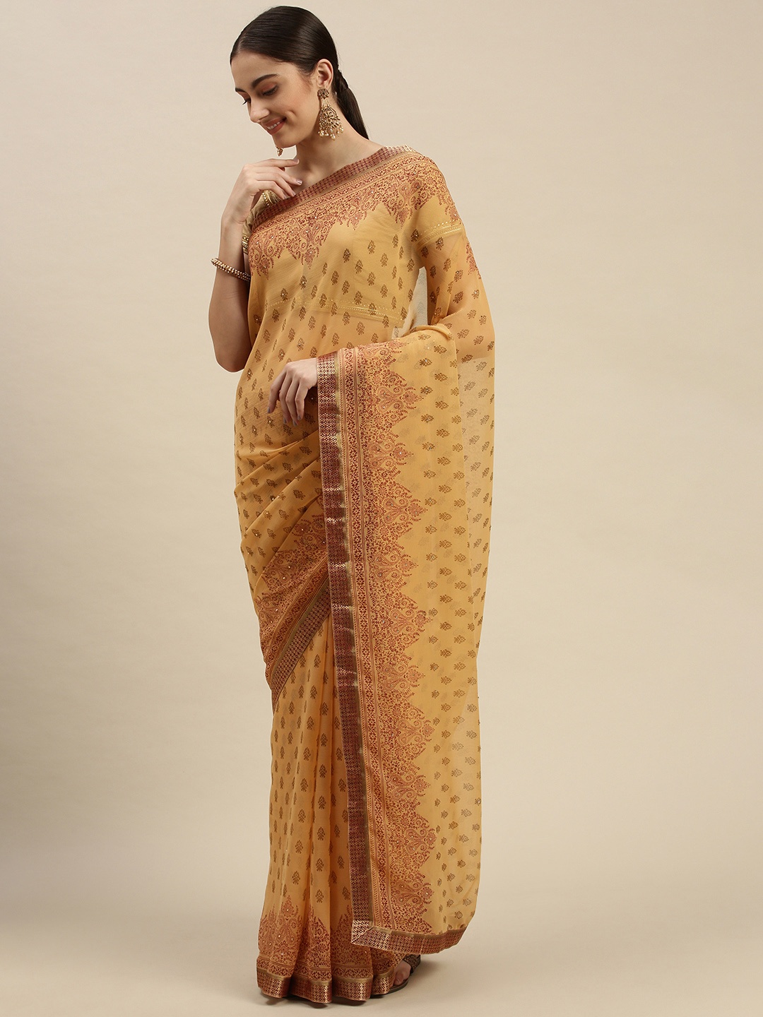 

Triveni Beige Ethnic Motifs Beads and Stones Pure Chiffon Saree