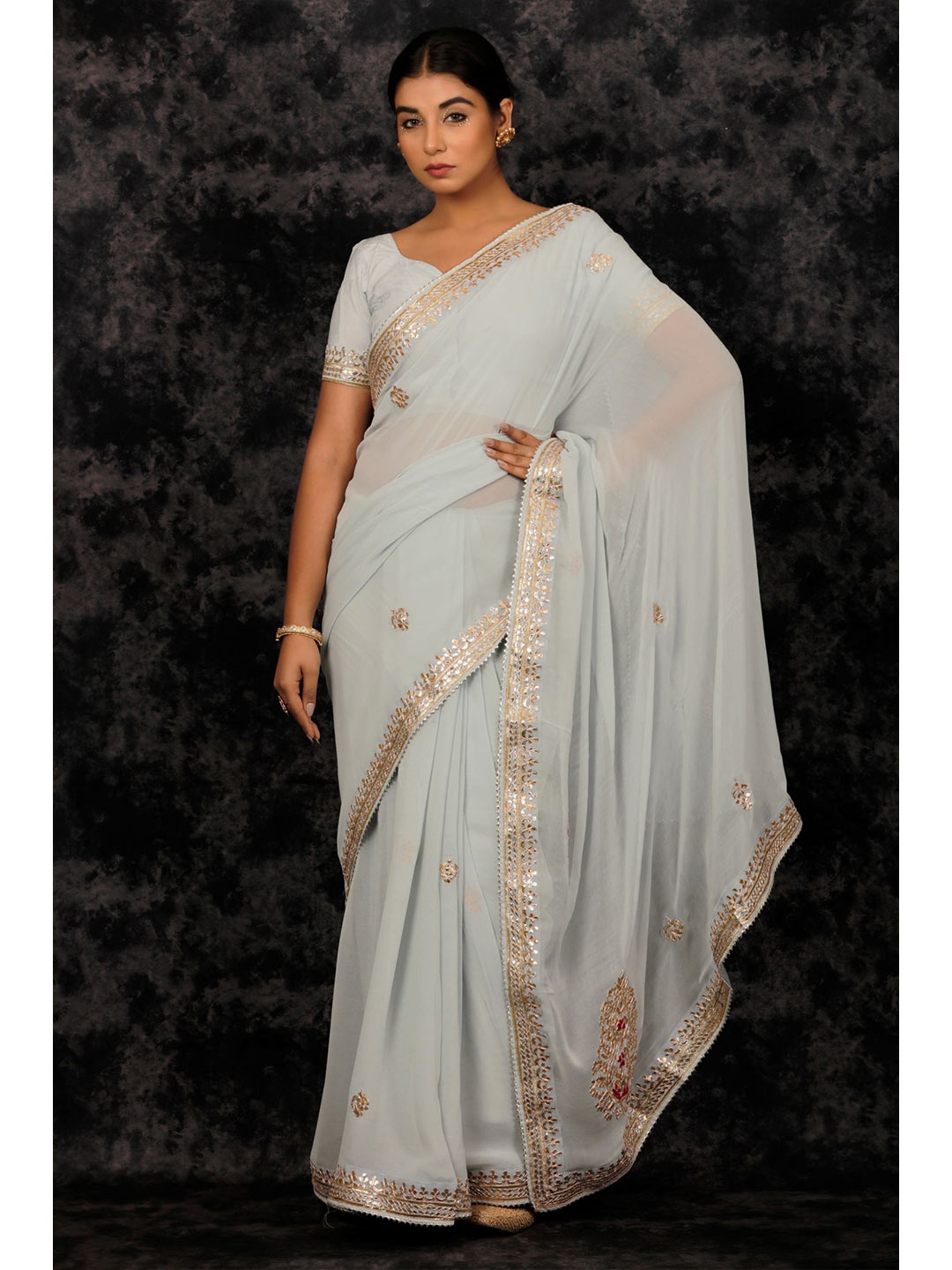 

Geroo Jaipur Grey Handcrafted Gota Patti Georgette Saree